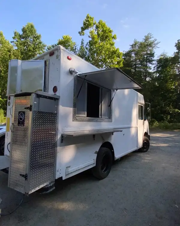 White Taco Truck — rear three-quarter view with the service window open