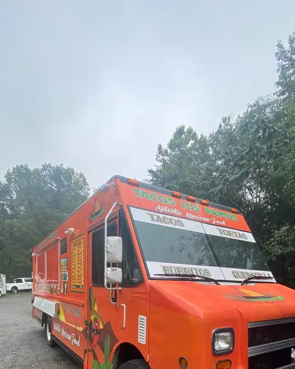 Tacos Los Primos — wrapped truck from the front