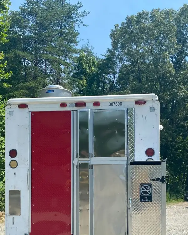 White Taco Truck — rear view with the red door