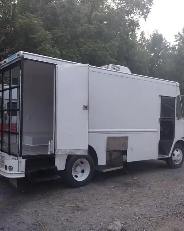 Mobile Boutique — rear three-quarter view at dusk