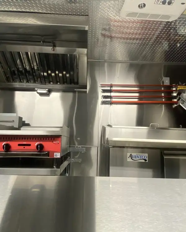 Pizza Truck — cook line under the hood next to the pizza oven