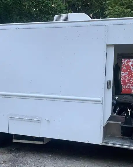 Mobile Boutique — side view with the cab door open