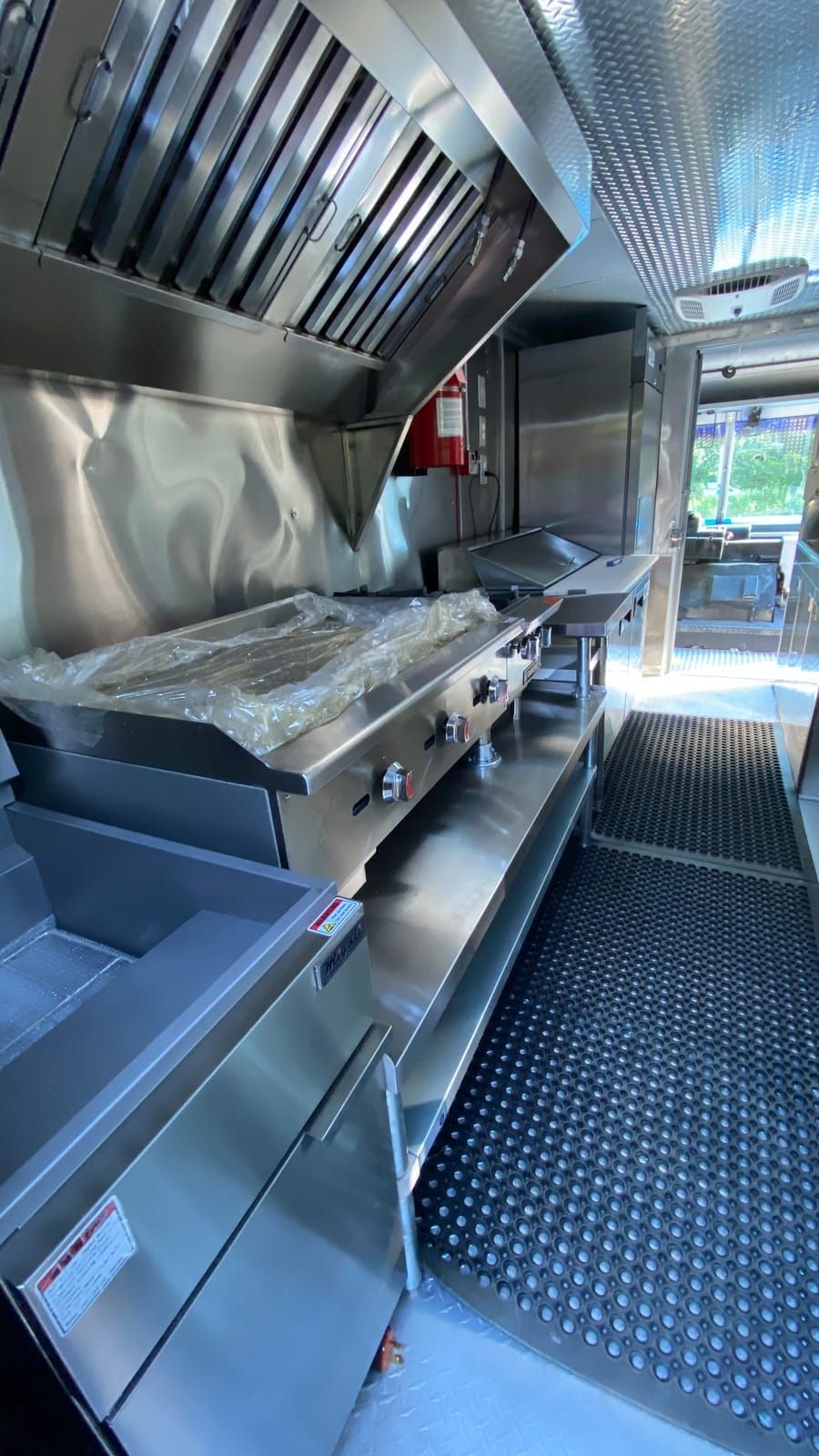 White Taco Truck — griddle and cook line along the galley