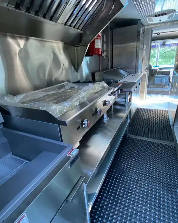 White Taco Truck — griddle and cook line along the galley