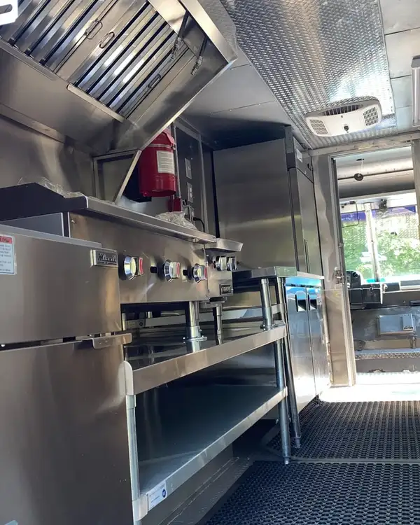 White Taco Truck — cook line with prep tables