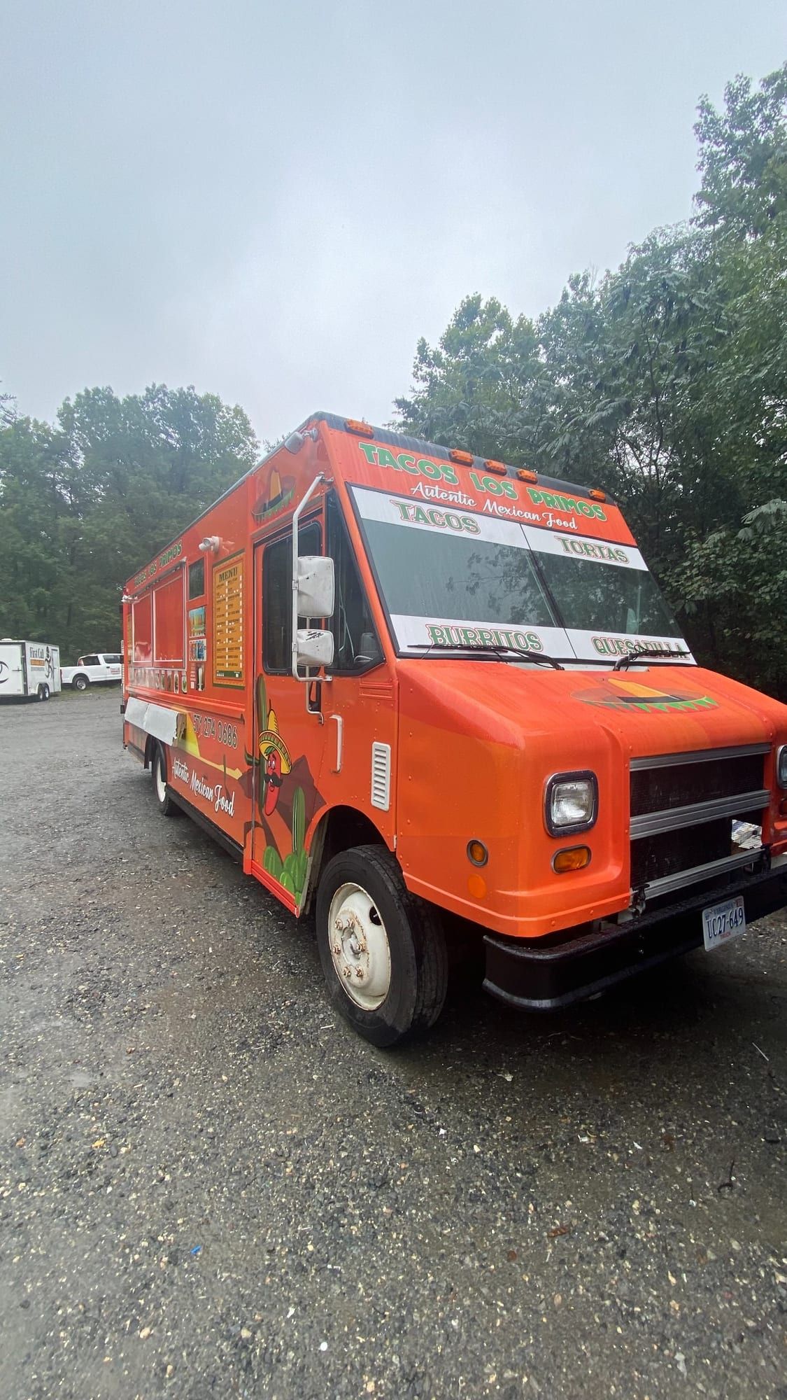 Three-quarter front view of the branded Tacos Los Primos truck
