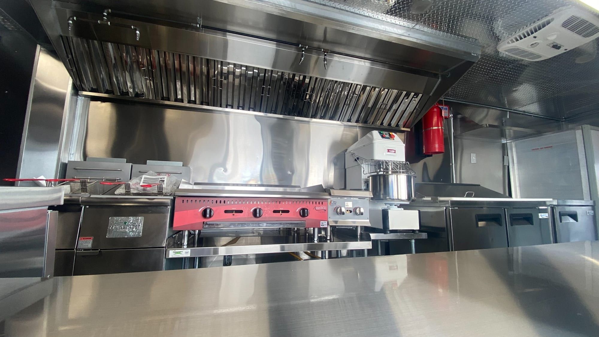 Complete Double Kitchen cook line under a commercial hood