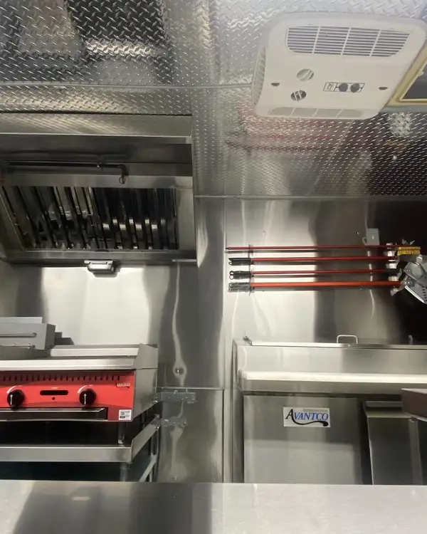 Pizza Truck — cook line with the pizza oven and peels