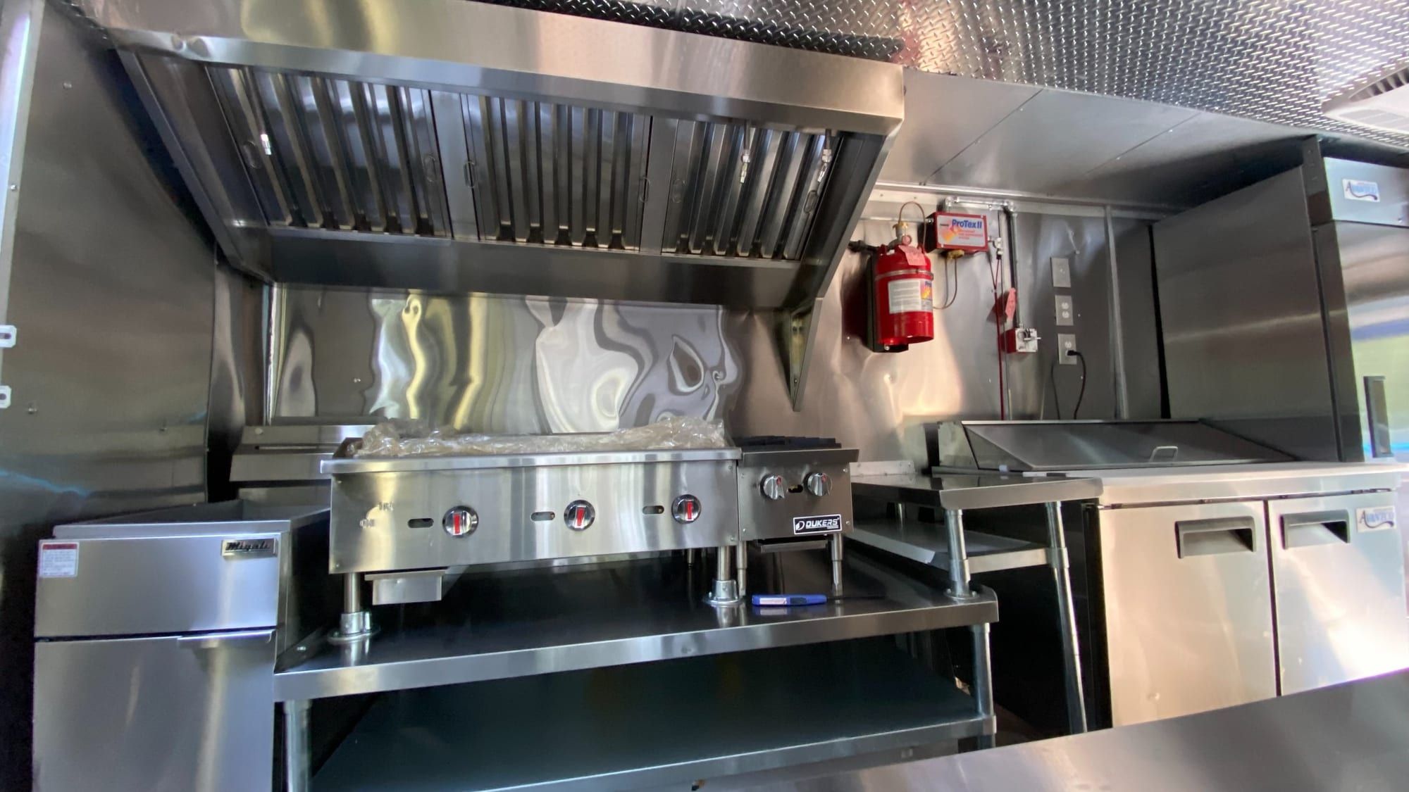 White Taco Truck — cook line with commercial hood