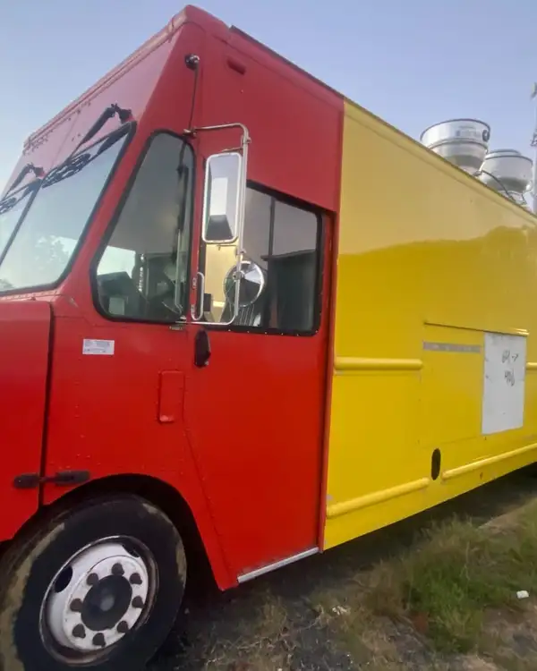 Mexican Food Truck — red cab and yellow body, side view