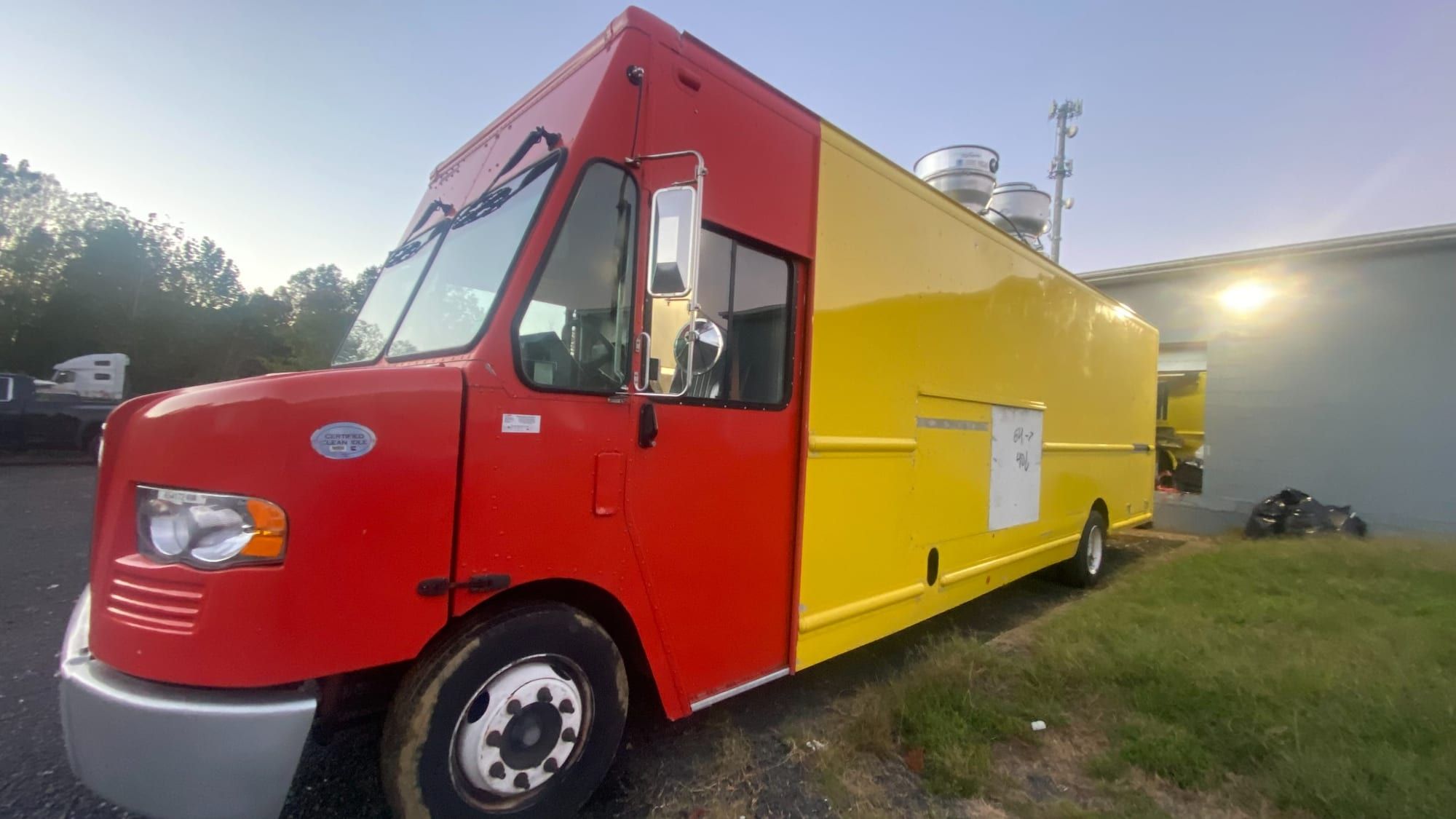 Red and yellow Mexican food truck, side view