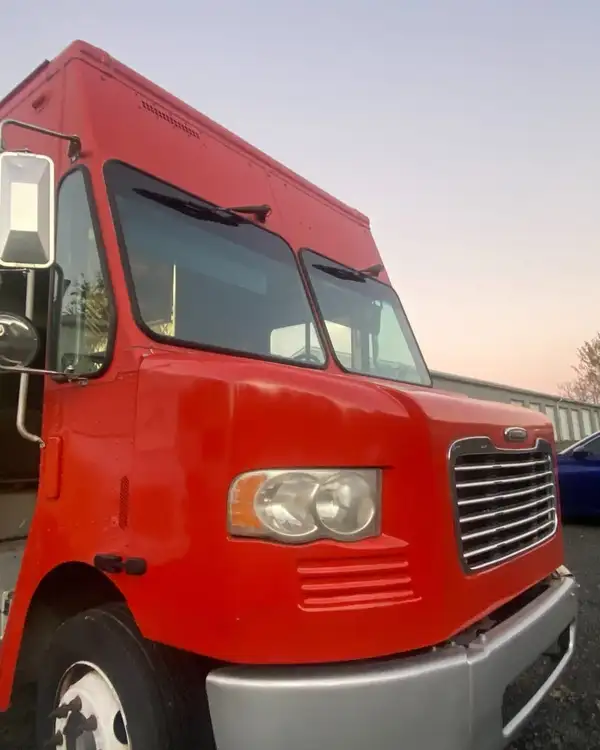 Mexican Food Truck — red and yellow truck, front three-quarter view