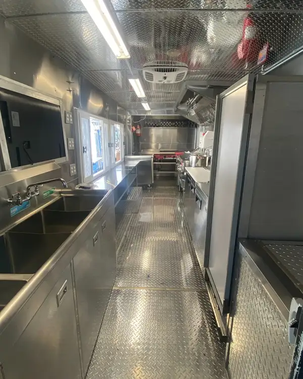 Double Kitchen — finished galley with sinks and reach-in refrigerator