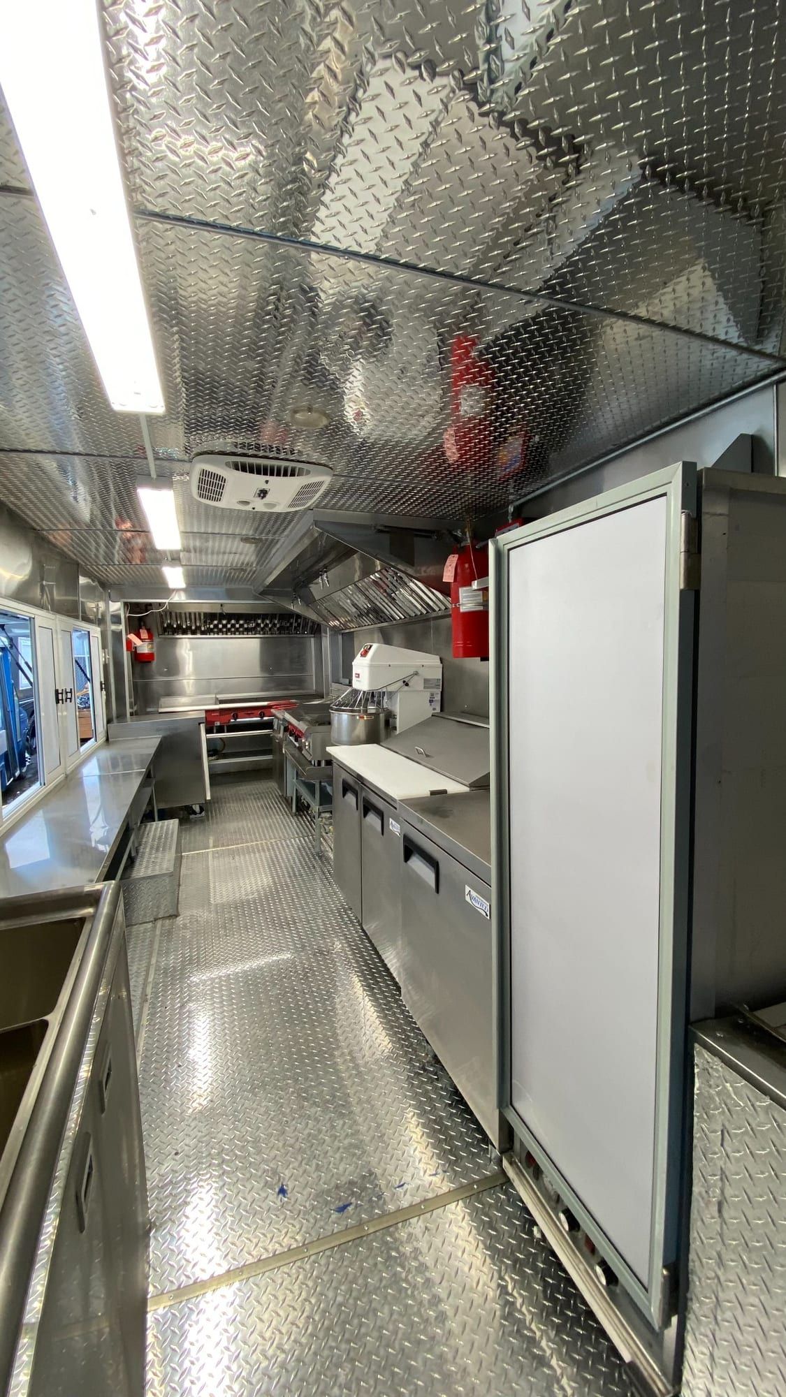 Double Kitchen galley with reach-in refrigeration and stainless counters