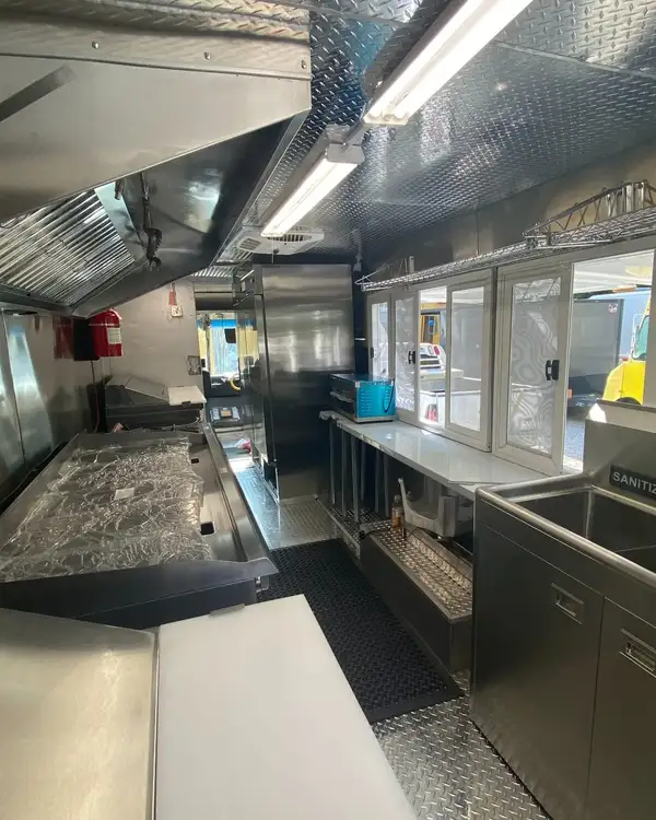 Tacos Los Primos — griddle and service windows