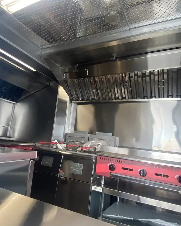 Double Kitchen — two hood sections over the cook line