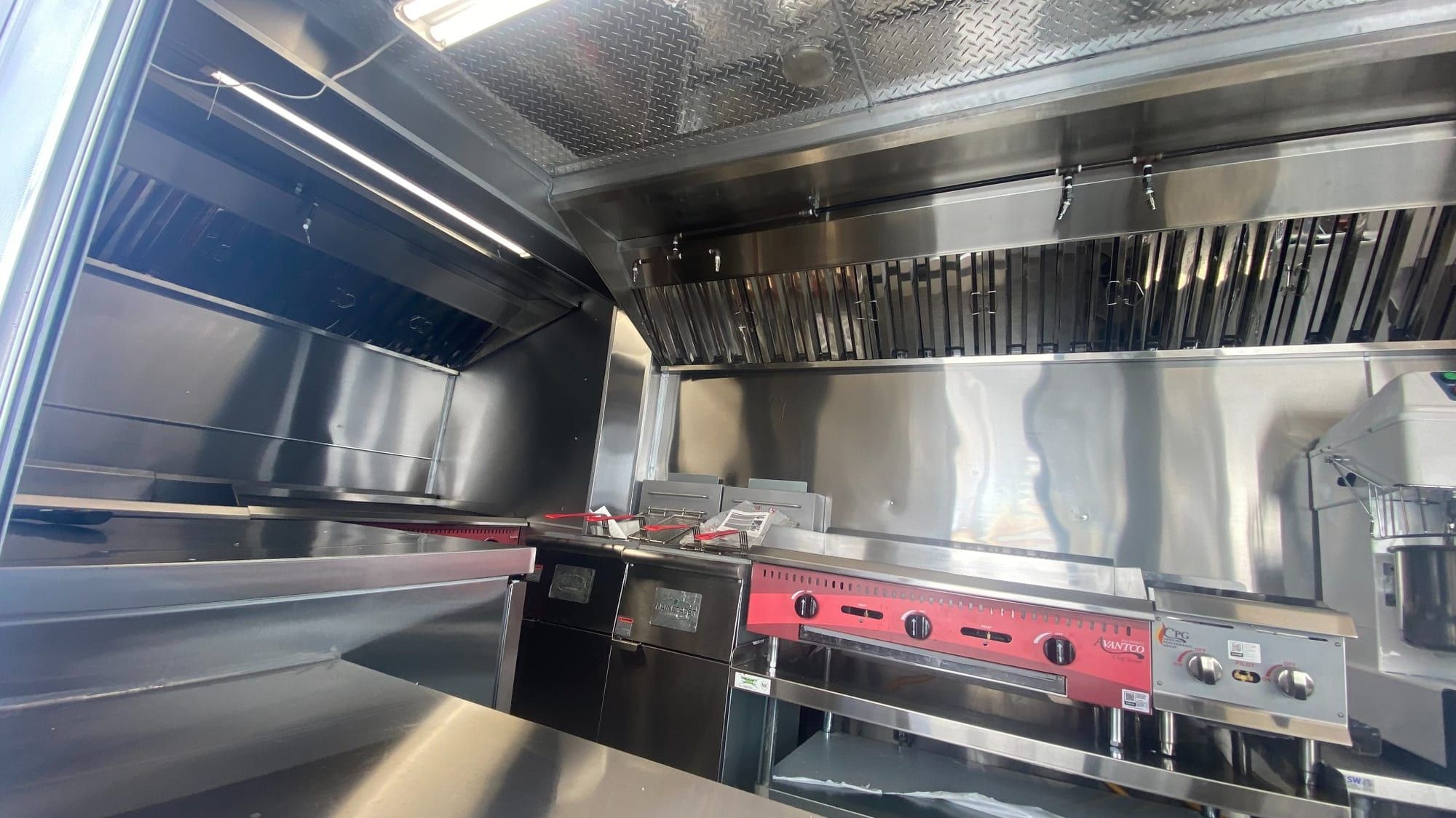 Commercial hood over the Double Kitchen cooking equipment