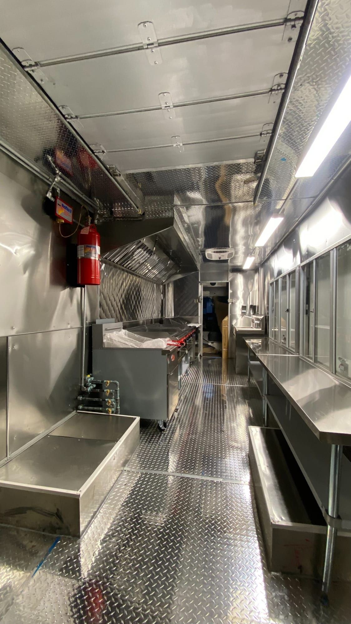 Long stainless galley inside the Mexican food truck