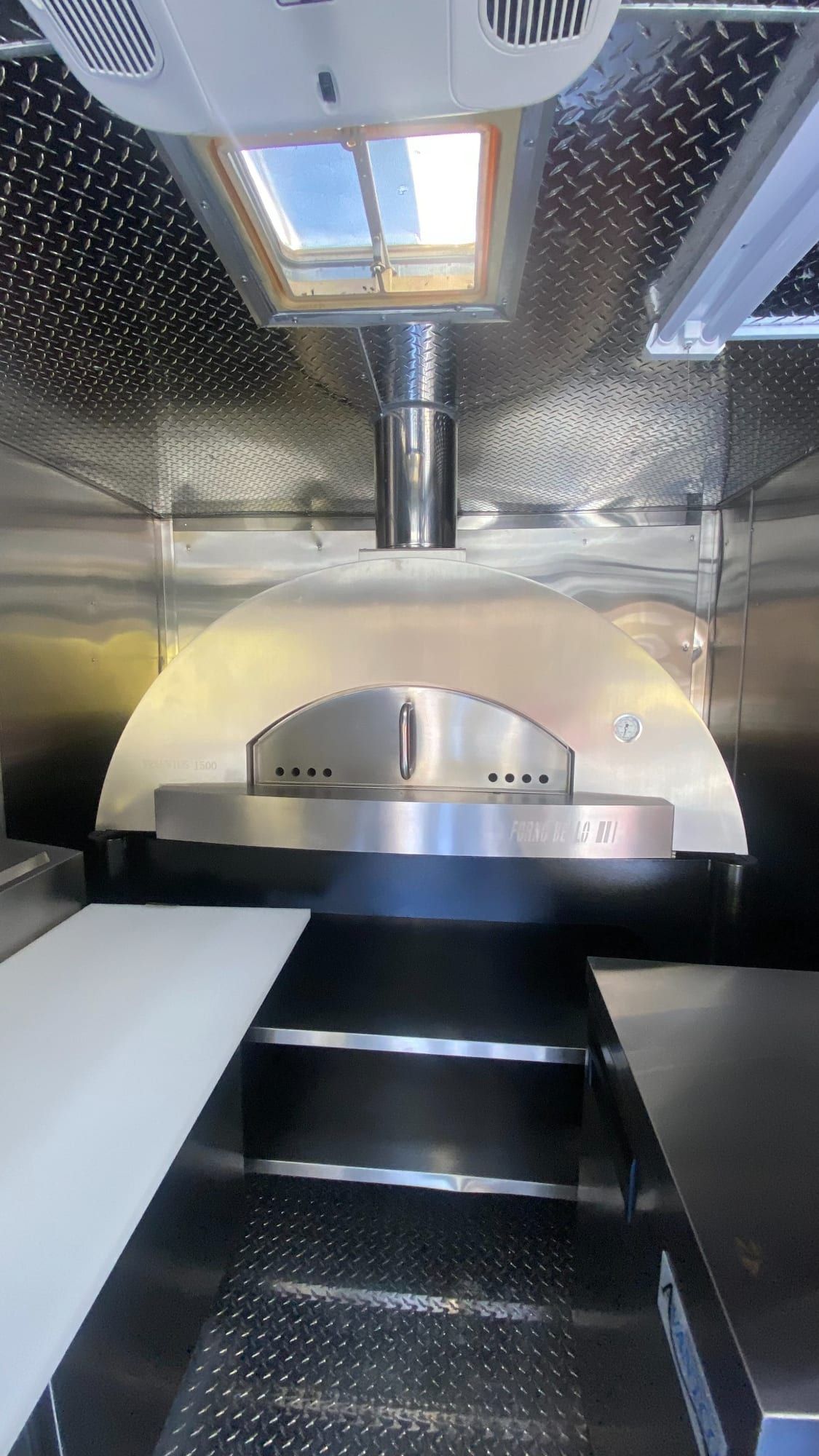 Pizza oven installed at the end of the truck kitchen