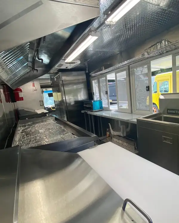 Tacos Los Primos — prep counter toward the service windows